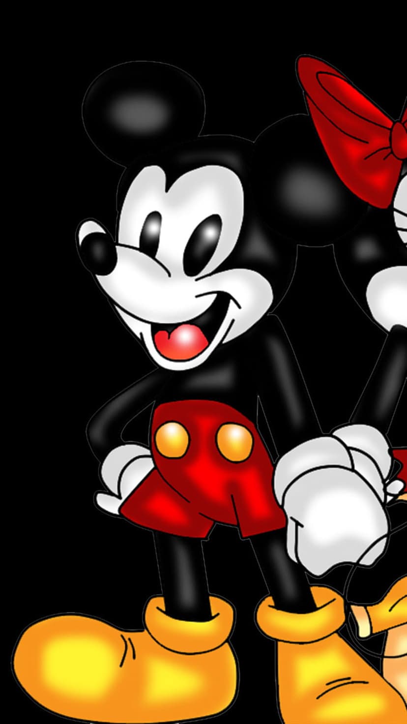 Mickey and Minnie Mouse wearing red attire and yellow shoes while posing against a solid black background.