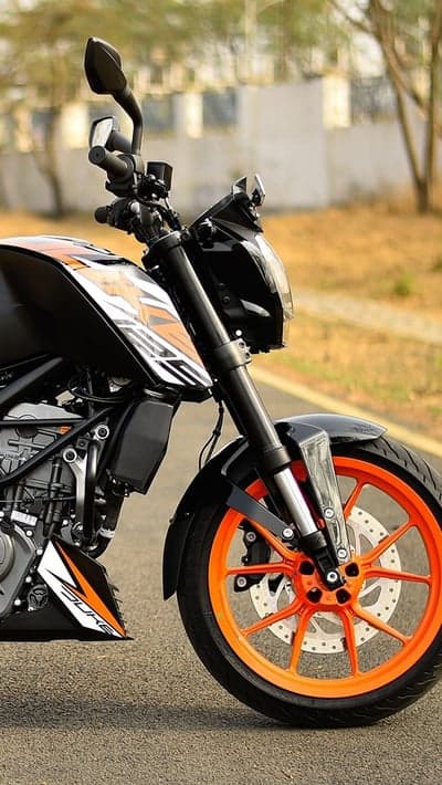 Close-up of orange and black KTM Duke motorcycle wheel