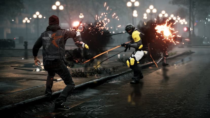 Delsin Rowe fires smoke embers at soldiers on a wet city street at night with glowing lights and explosions.