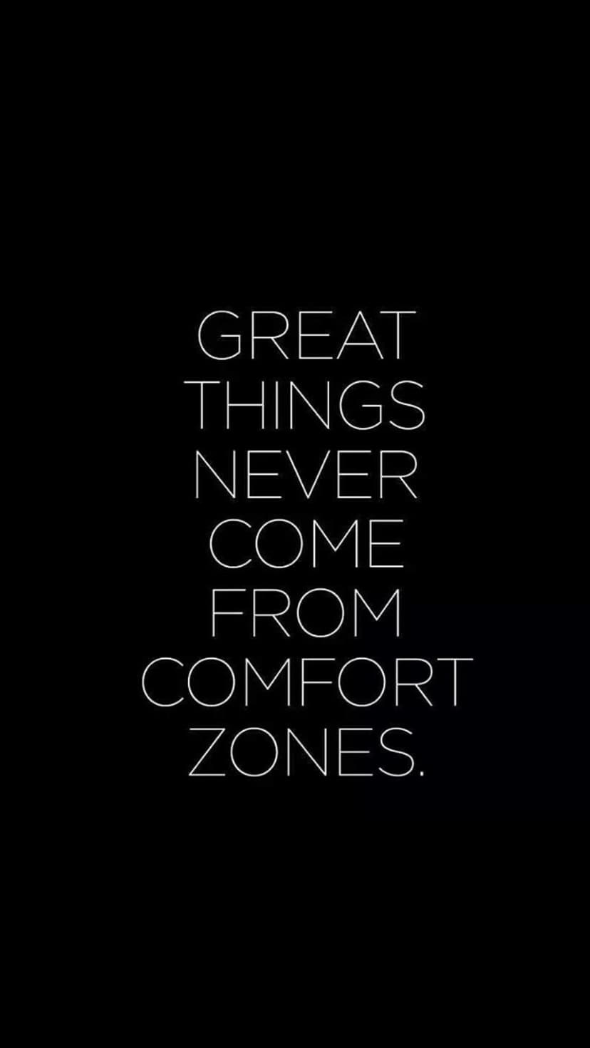 White sans-serif text reading Great things never come from comfort zones centered on a solid black background.