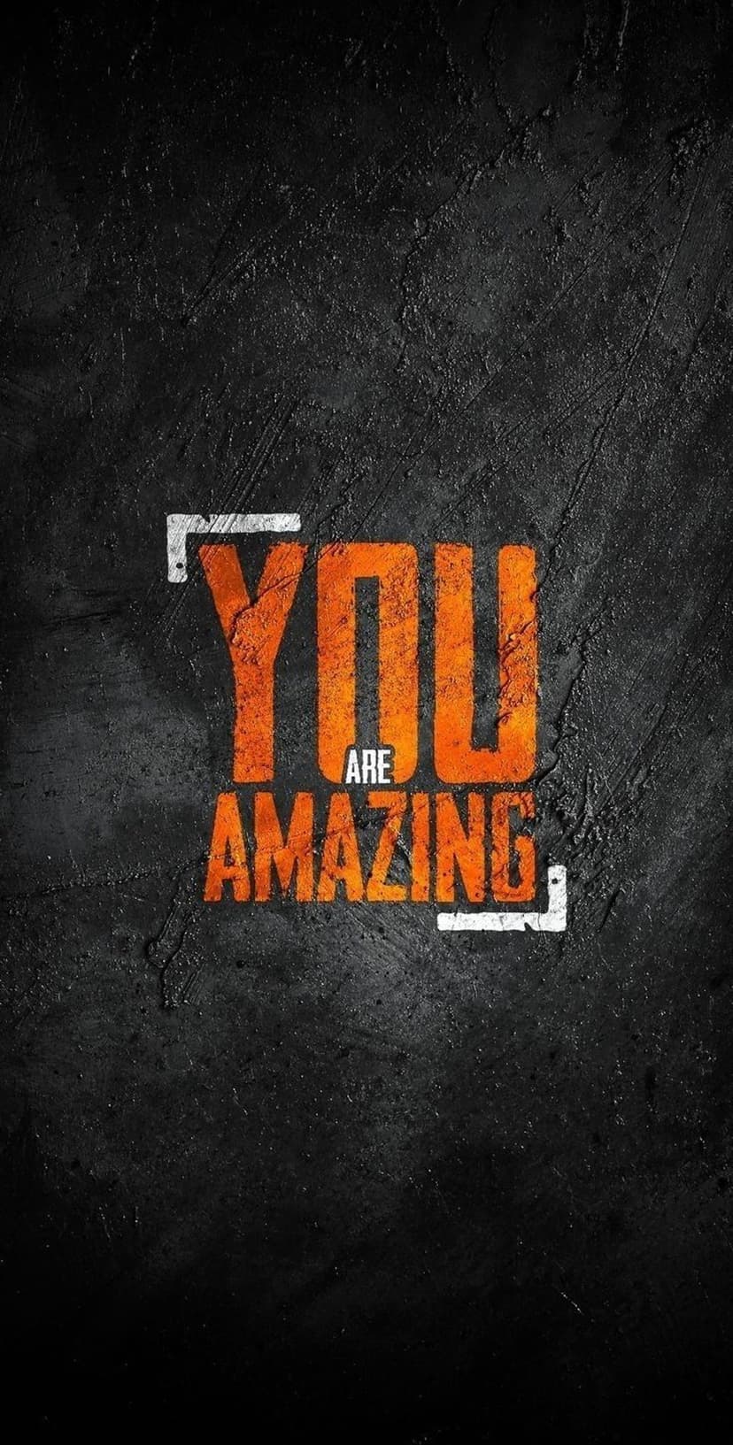 You Are Amazing phrase in bold orange letters centered on a dark textured surface for a vertical mobile layout.