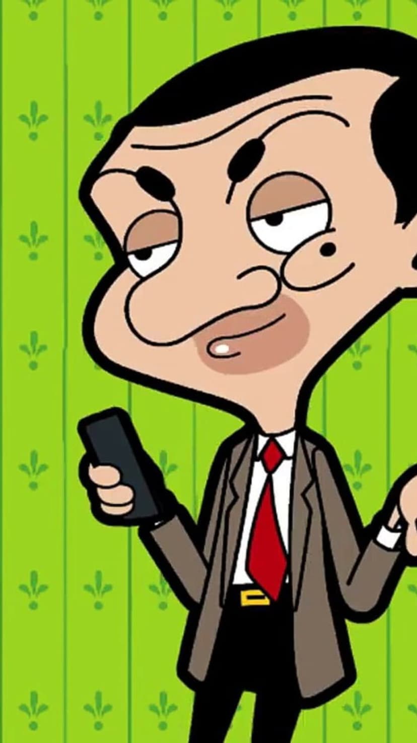 Mr. Bean holding a smartphone wearing a brown suit and red tie against a green floral patterned background.
