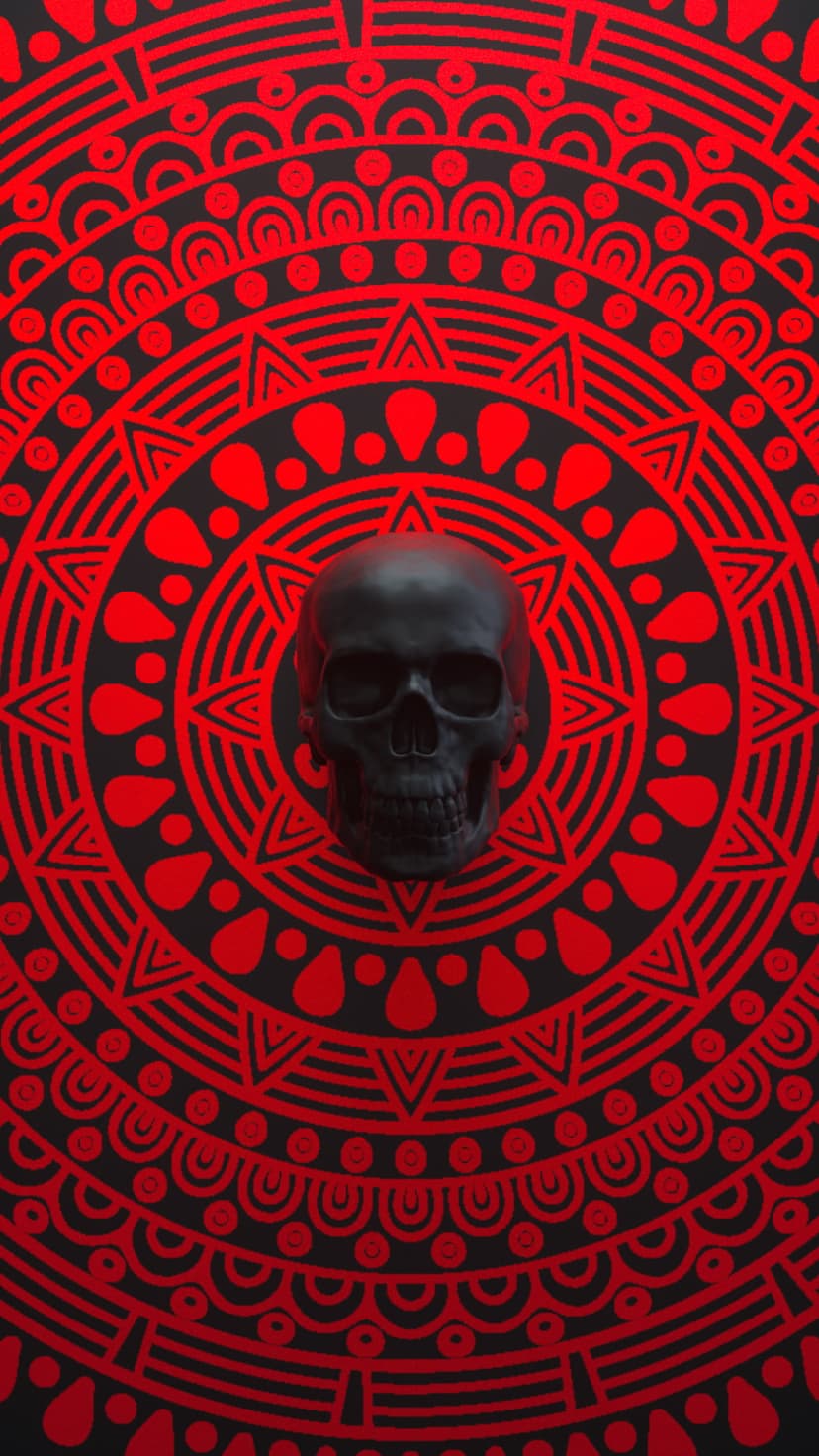 Human skull with a matte black finish centered over a symmetrical red and black mandala pattern with dots.