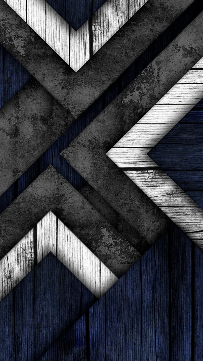 Overlapping dark blue and white wood planks arranged in a chevron pattern with distressed gray grunge textures.