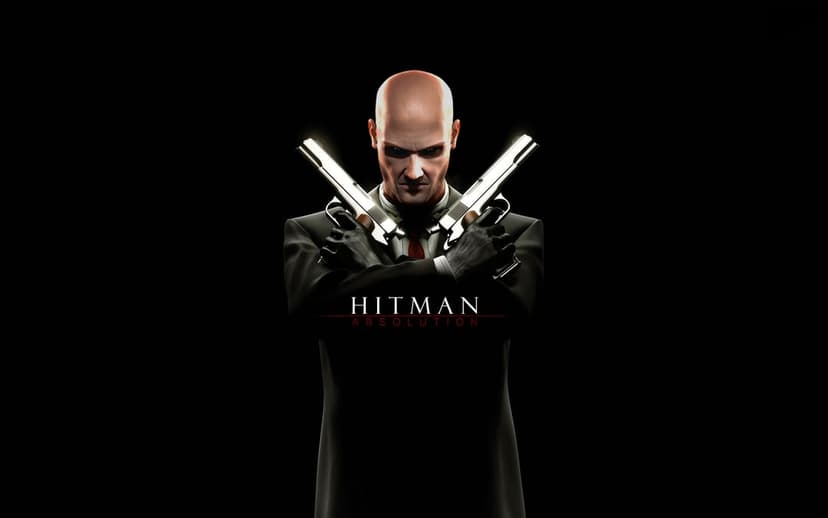 Agent 47 crosses two silver pistols while wearing a black suit and red tie against a dark background.