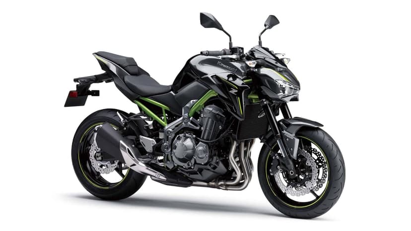 Kawasaki Z900 naked sport motorcycle with a lime green trellis frame and black bodywork on a white background.