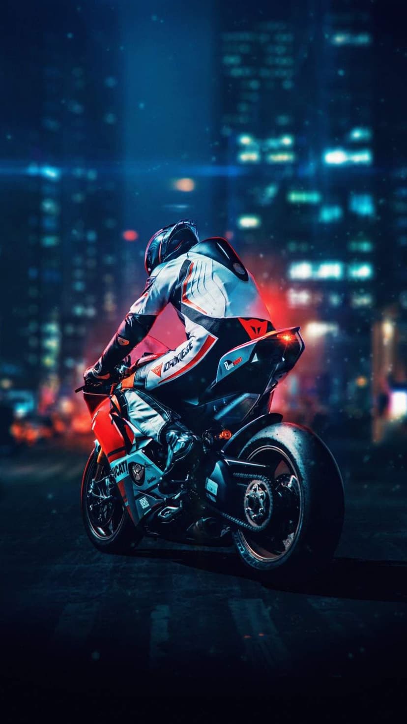 Motorcyclist in black racing gear leans on a glowing sportbike while riding past neon skyscrapers at night.