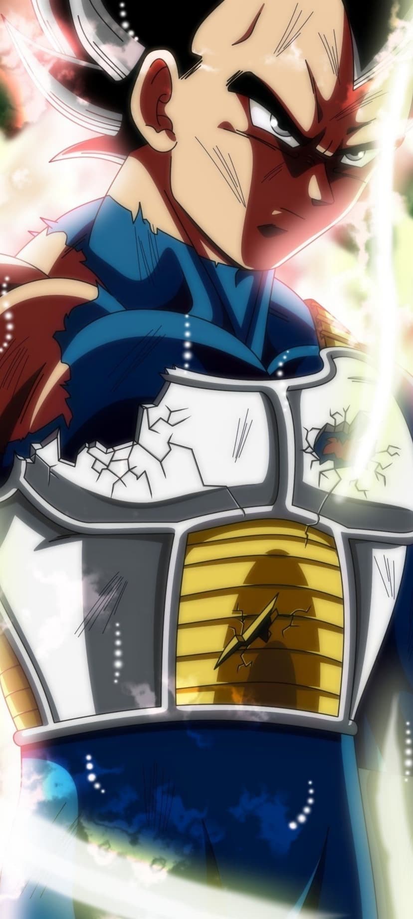 Vegeta grits his teeth while surrounded by glowing blue energy and wearing broken white and yellow battle armor.
