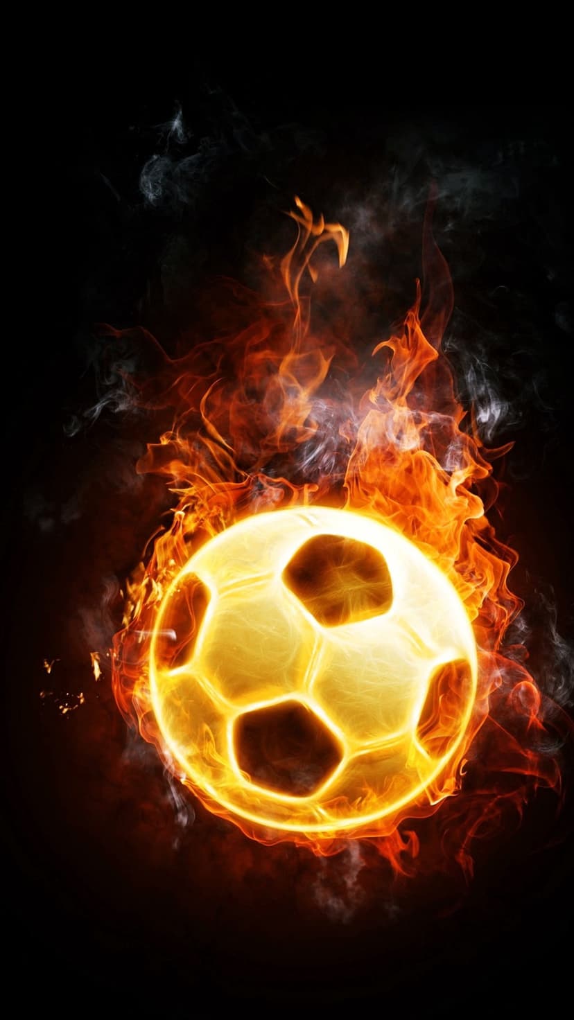 Soccer ball engulfed in bright orange flames and swirling smoke trails against a solid black background.