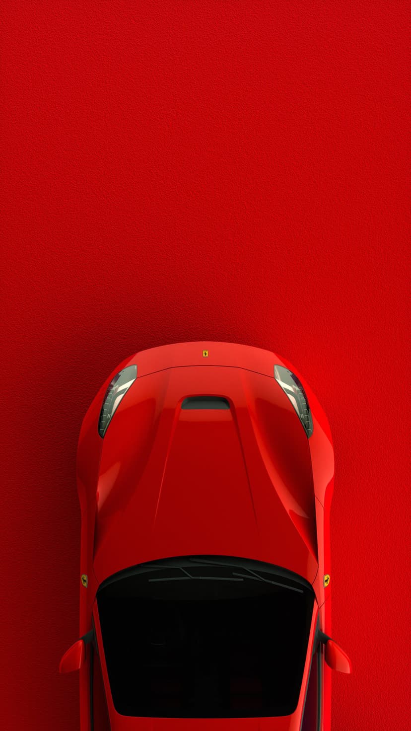 Red Ferrari sports car seen from a top-down view on a crimson textured background with visible hood details.
