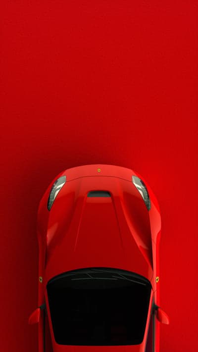 Top View of Red Ferrari Sports Car on Red Background