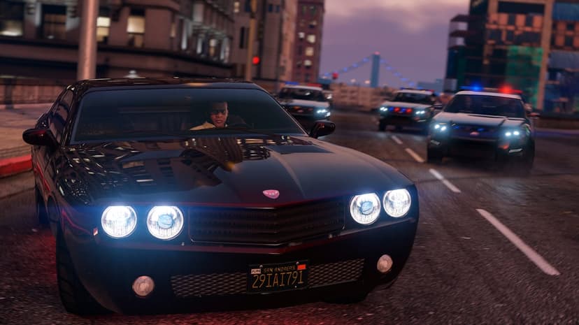Black muscle car driving away from police cruisers with flashing sirens on a city street at twilight.