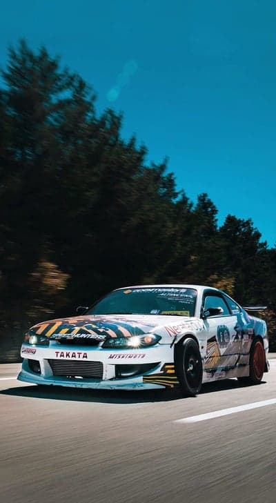 Drifting Sports Car in Motion with Vibrant Graphics