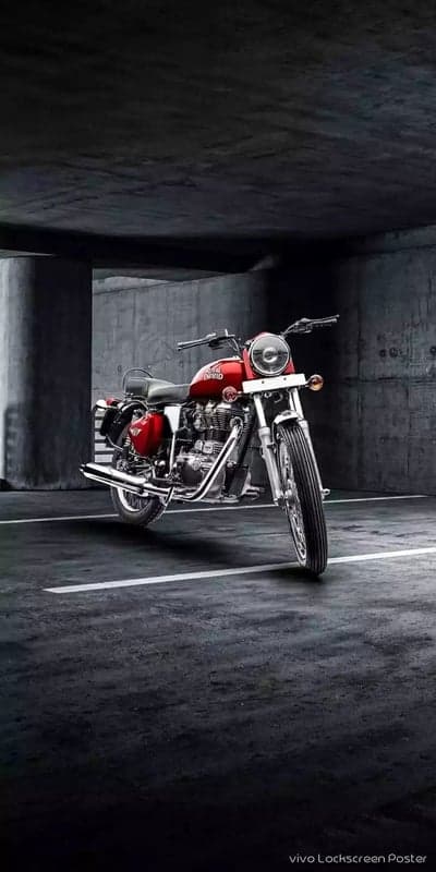 Red Royal Enfield Classic Motorcycle in Industrial Parking Garage