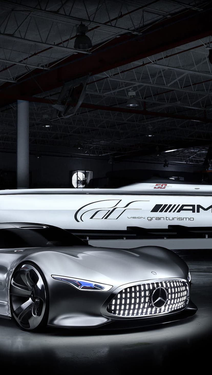 Mercedes-Benz Vision Gran Turismo concept car features a silver body, blue LED headlights, and aggressive grille.