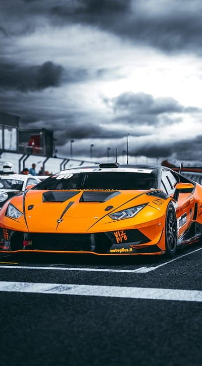 Orange Lamborghini Huracan race car on track