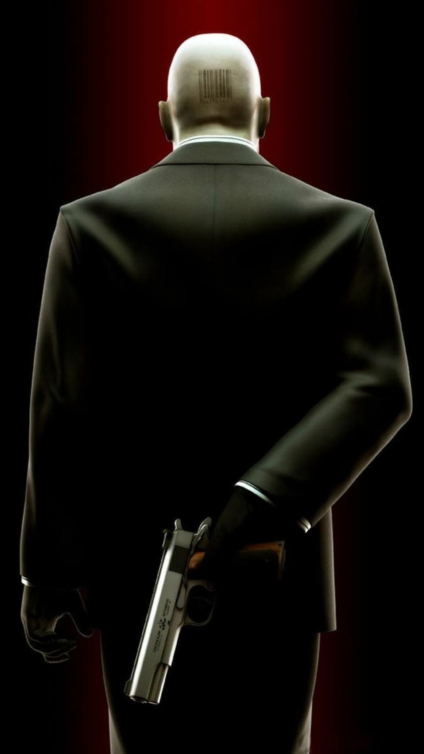 Agent 47 from Hitman seen from behind holding a silver pistol behind his back against a dark red background.