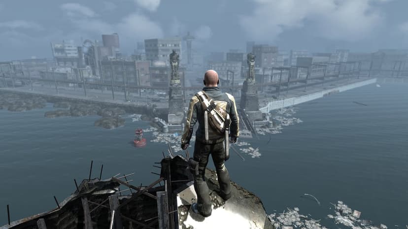 Man in a yellow jacket stands on a ledge looking out over a foggy, ruined city by the water with debris.