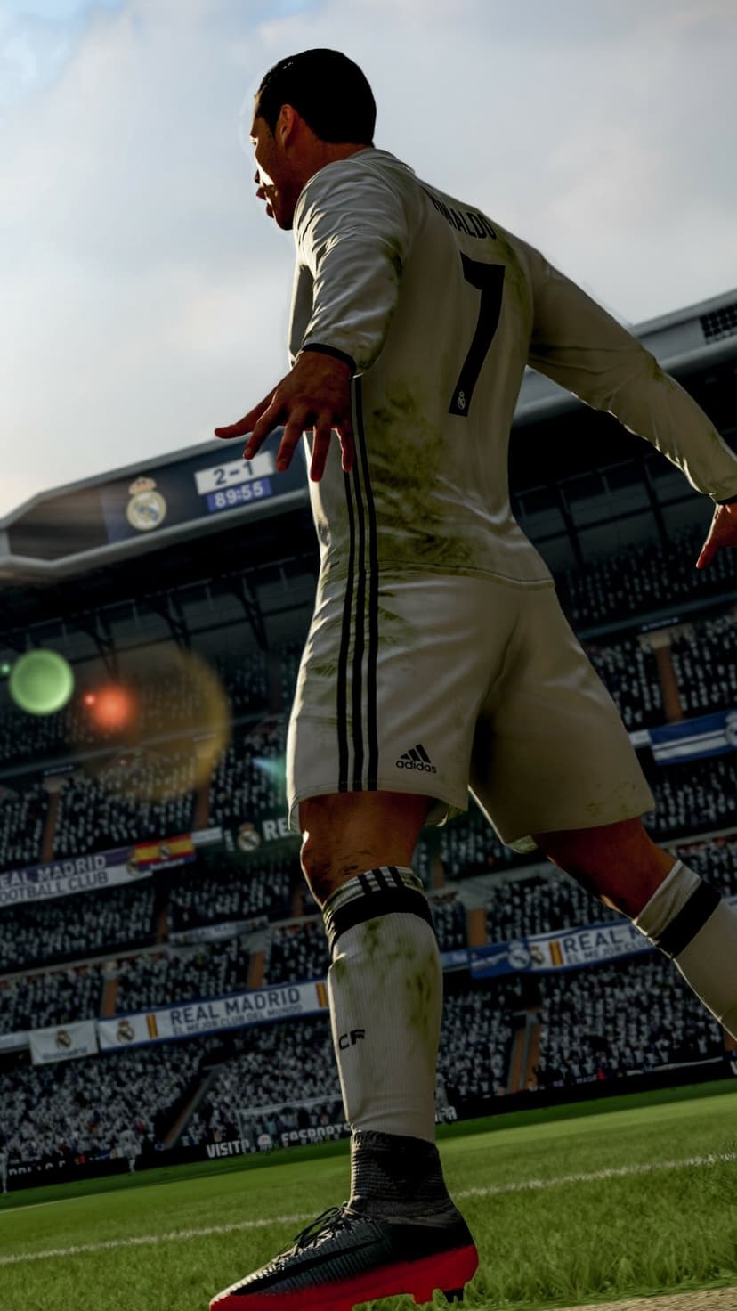 Cristiano Ronaldo in a dirty Real Madrid kit celebrating a goal in a sun-drenched, packed soccer stadium.