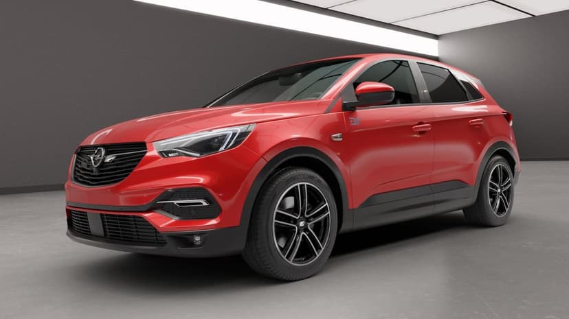 Red compact SUV with black alloy wheels parked in a dark grey minimalist studio under soft overhead lighting.