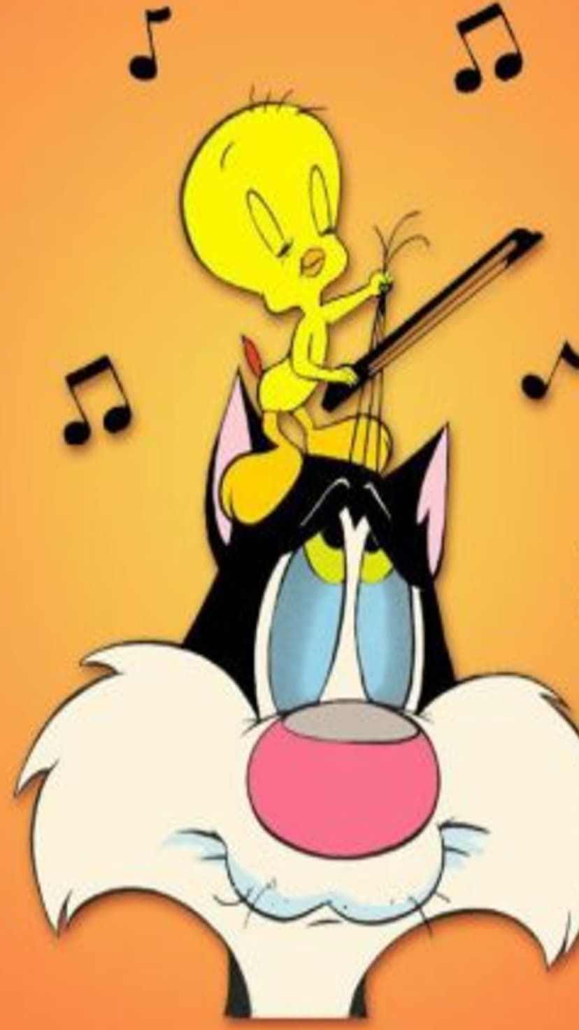 Tweety Bird plays a small violin while standing on Sylvester Cat’s head with musical notes floating nearby.