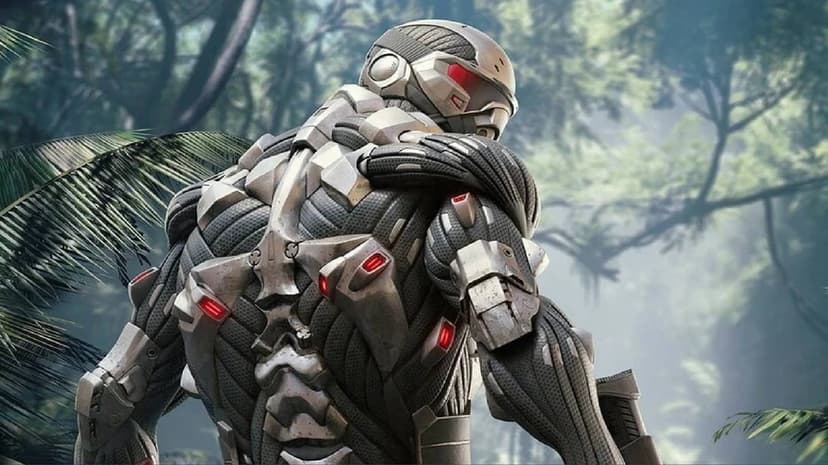 Nanosuit soldier in a forest from behind, showing carbon fiber armor with red lights and blurred green foliage.