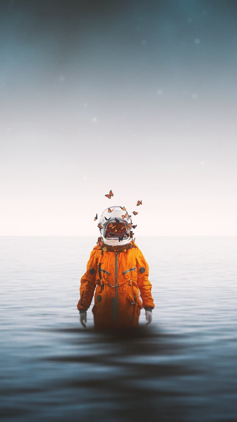 Astronaut in a bright orange suit stands in dark water as vibrant butterflies emerge from their glass helmet.