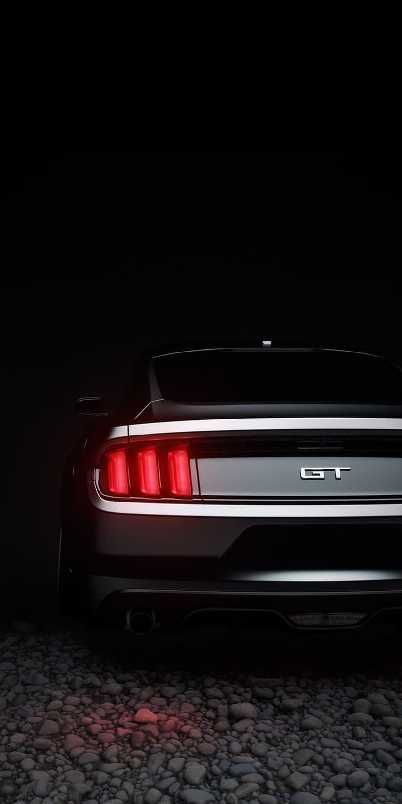 Ford Mustang GT red tri-bar taillights glowing on a dark textured gravel surface at night in a vertical view.