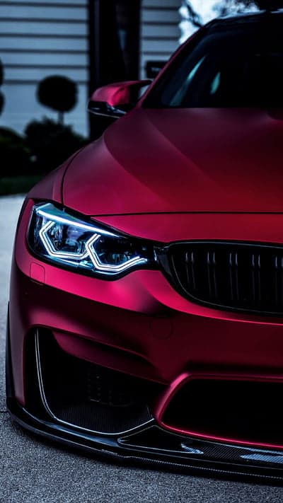 Matte Crimson BMW M4 Headlights and Grille Phone Wallpaper