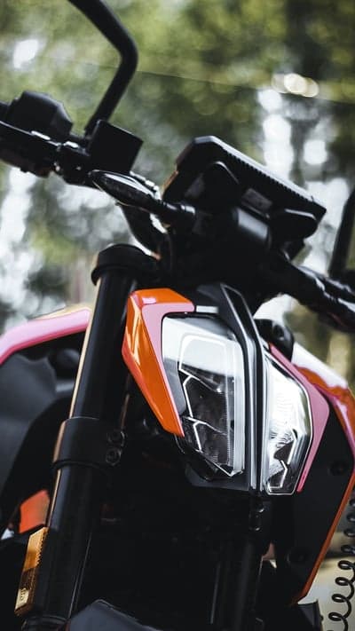 Close-up of KTM motorcycle front headlight and handlebars