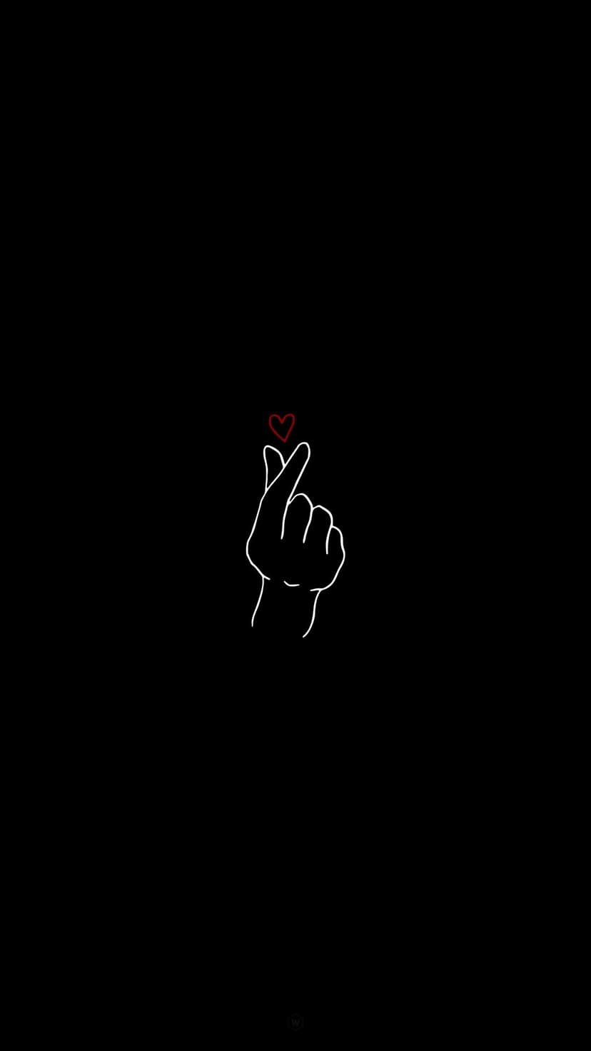 White hand outline forms a finger heart gesture with a small red heart icon against a solid black background.