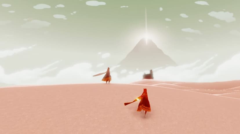 Red robed figures walk across a vast pink sand desert toward a glowing mountain peak under a soft green sky.