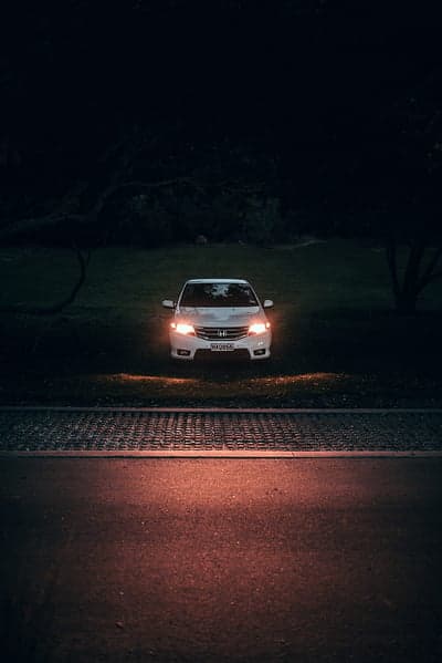 White Sedan Night Headlights Portrait Mobile Wallpaper