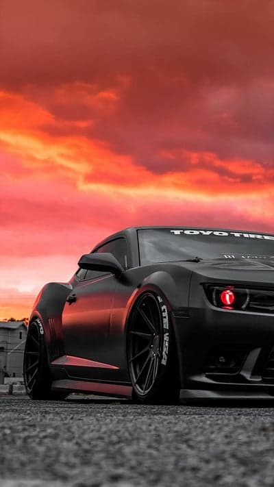 Menacing Widebody Black Camaro Sunset Mobile Wallpaper