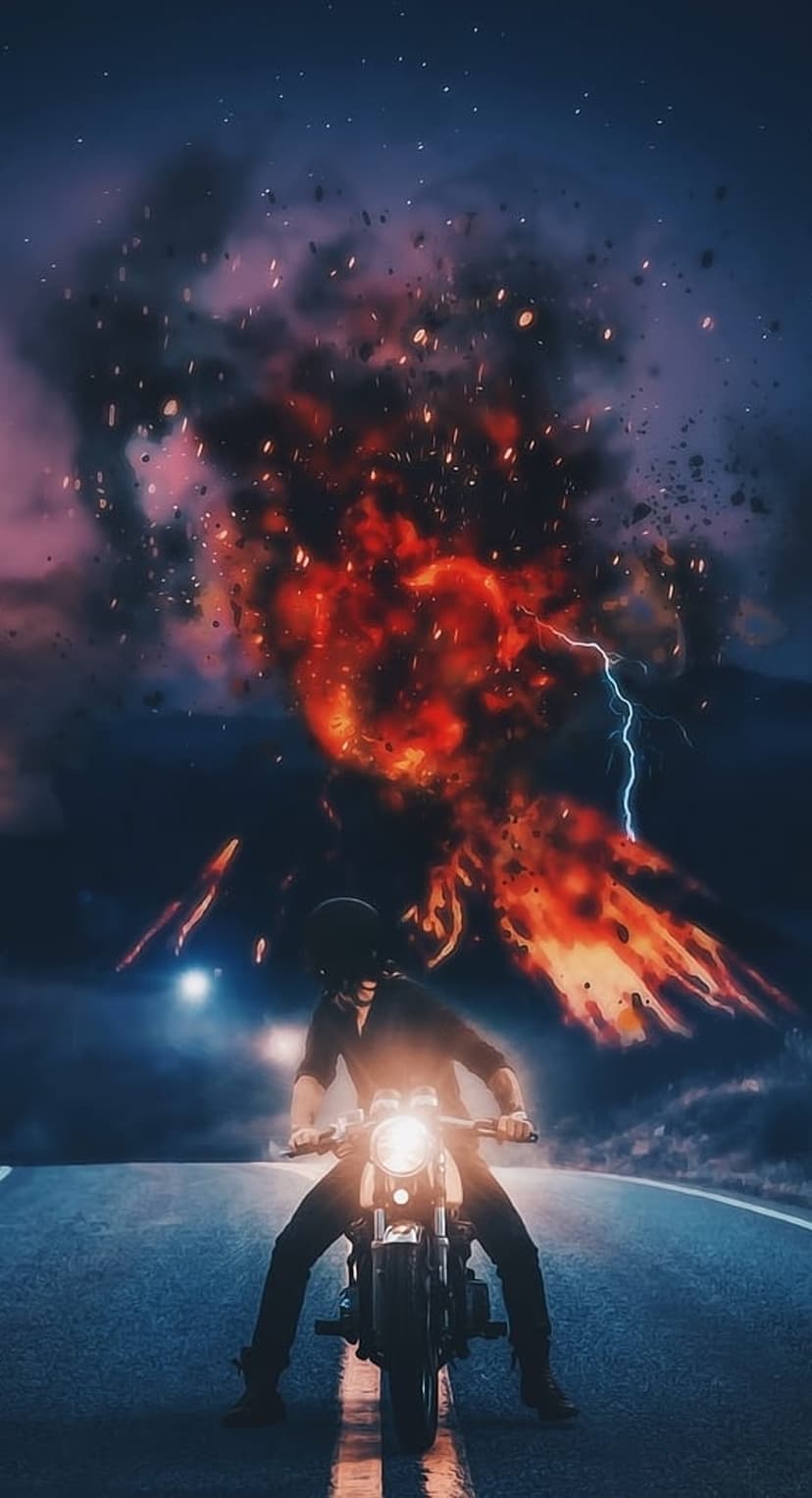 Motorcyclist in silhouette riding toward a massive orange explosion and blue lightning strikes on a dark road.