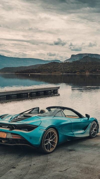 Blue McLaren Spider Lakefront Mountain Mobile Wallpaper
