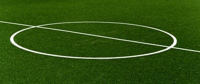 Green Soccer Field with White Center Circle and Line