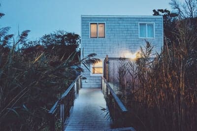 Beach House Path at Twilight with Reeds and Lights