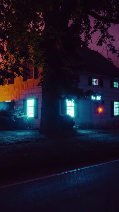 Neon Dwelling - Eerie Glow of a House at Night