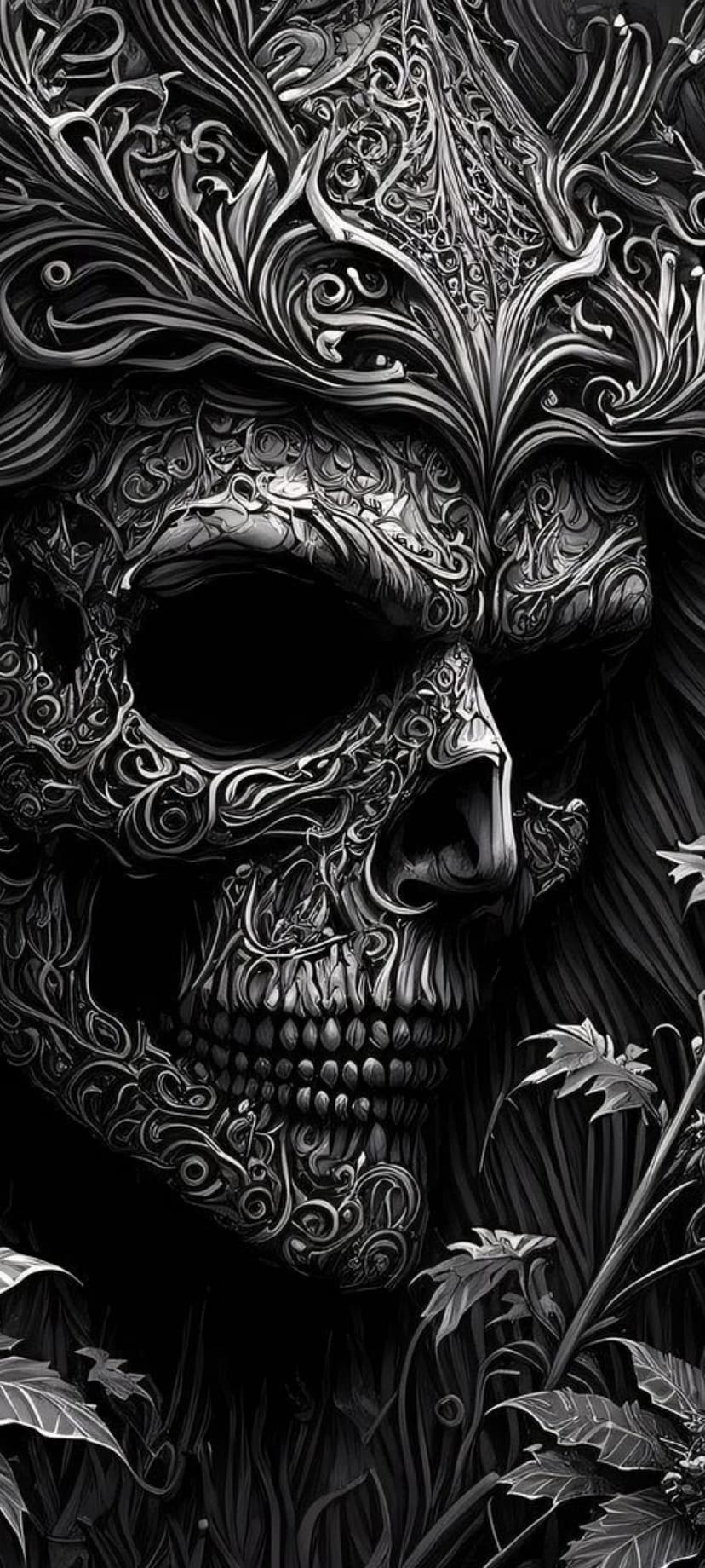 Ornate human skull with intricate floral vine etchings and deep shadows against a dark textured background.