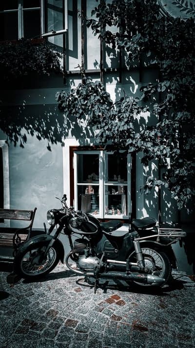 Vintage Motorcycle Cobblestone Street Mobile Wallpaper