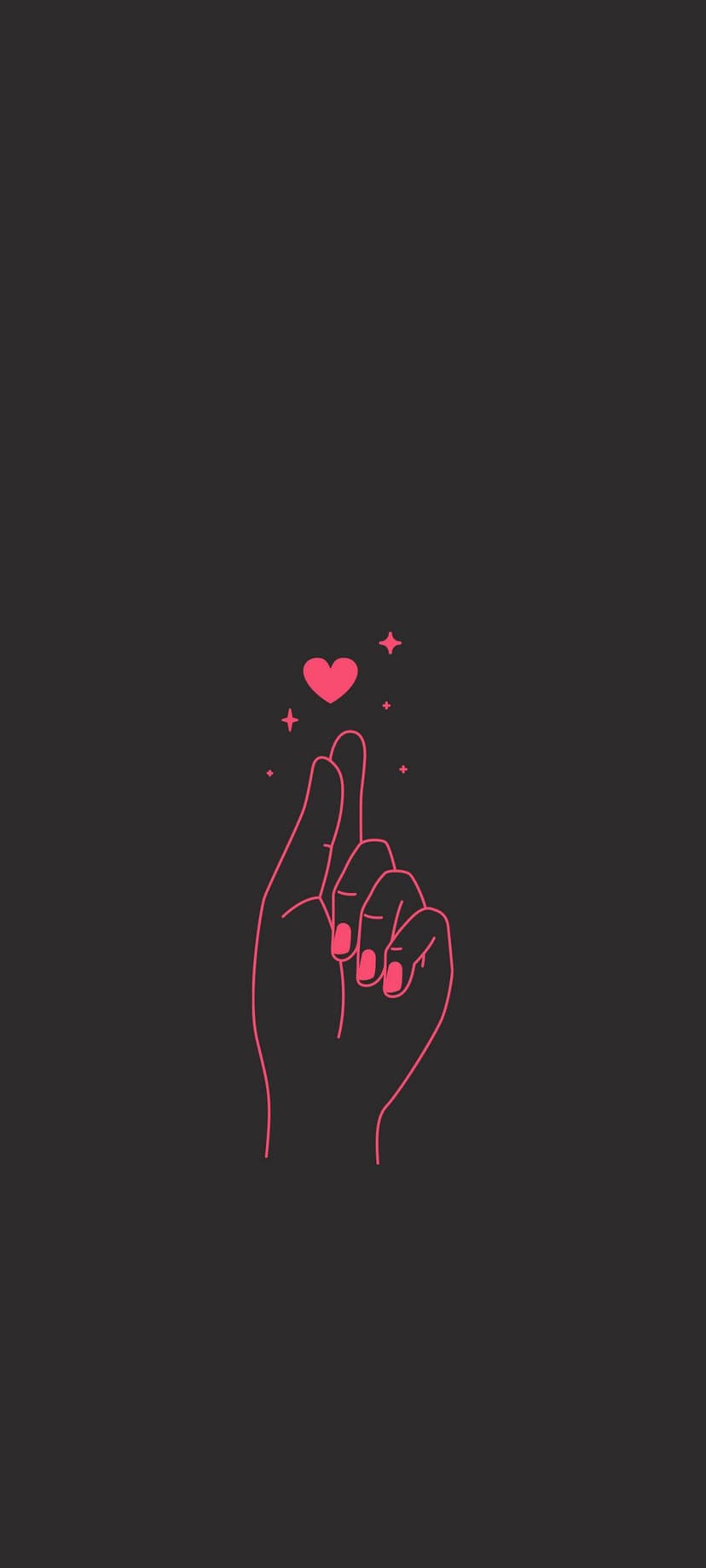 Pink glowing heart hovers over a hand making a finger heart sign against a dark background with small sparkles.