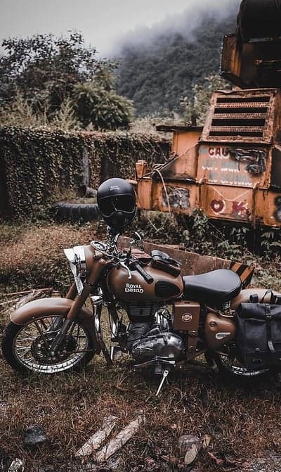Classic Royal Enfield Motorcycle Misty Forest Phone Background