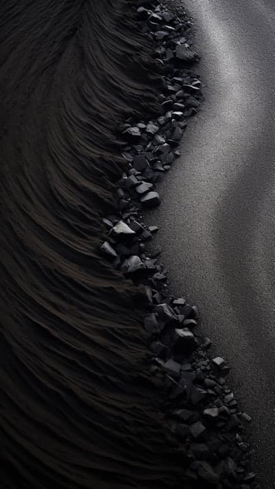 Dark Textured Landscape of Rocks and Sand