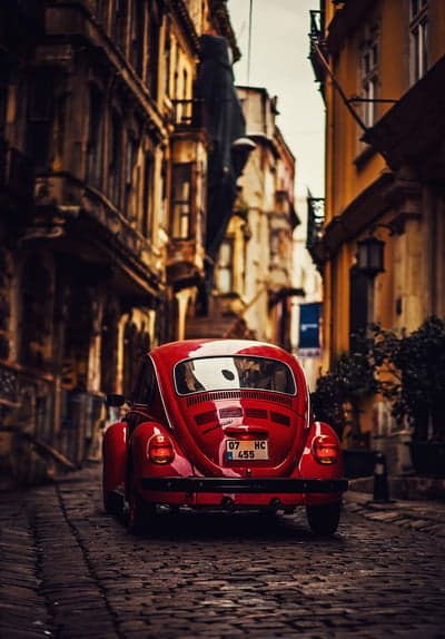 Classic Crimson Beetle Vintage Street Mobile Wallpaper