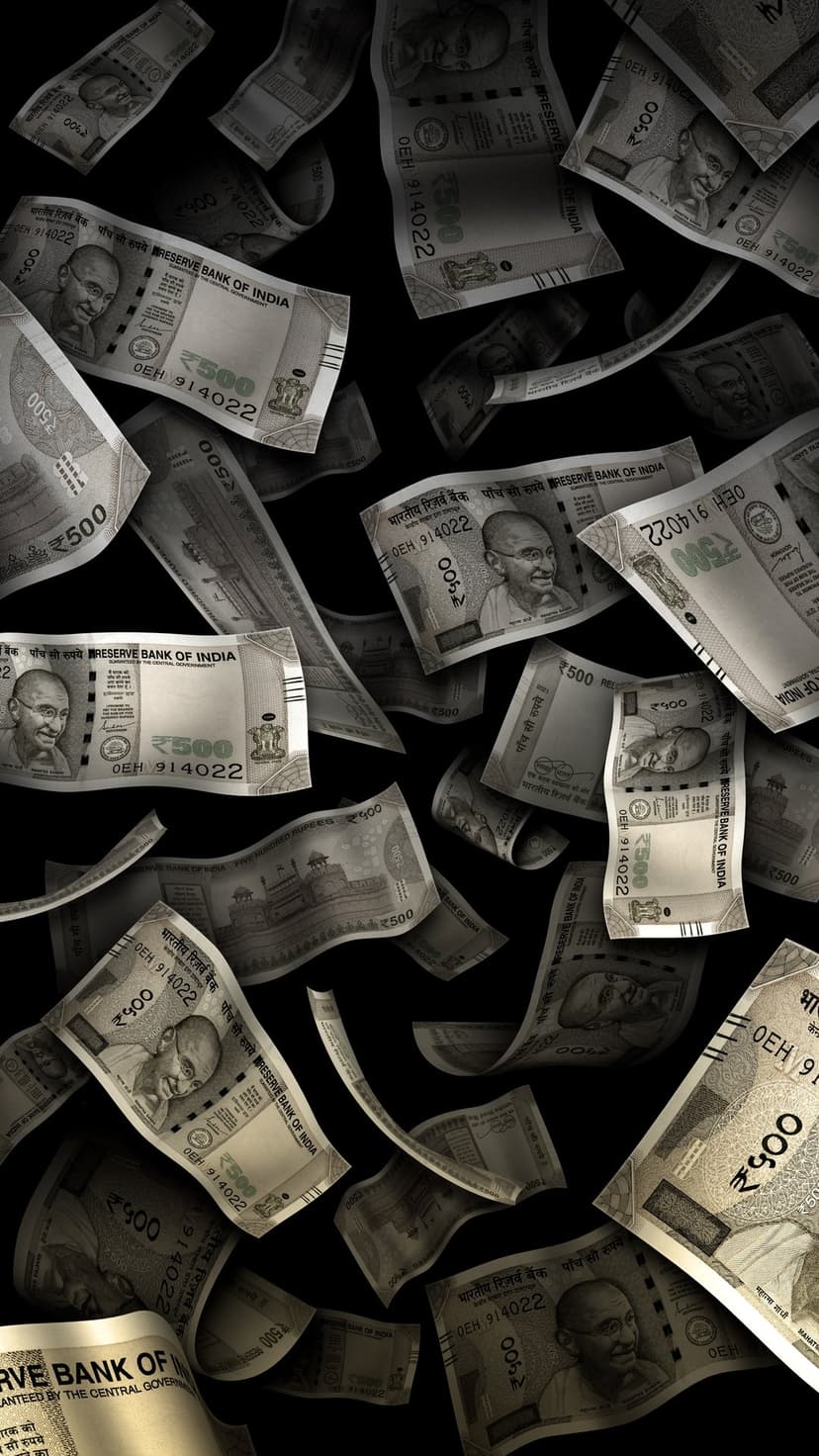 Indian 500 rupee notes tumbling through a dark space with detailed currency engravings and a vertical orientation.