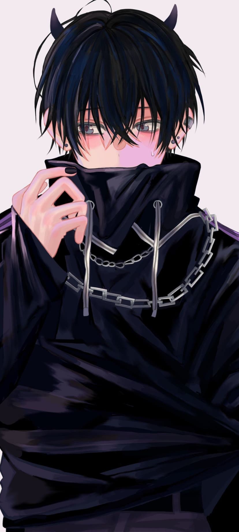 Demon boy with black horns and messy hair pulls a black hoodie over his face, showing silver chains and piercings.