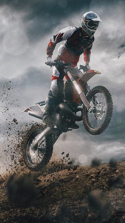 Motocross Rider Soars Through the Air Mid-Jump