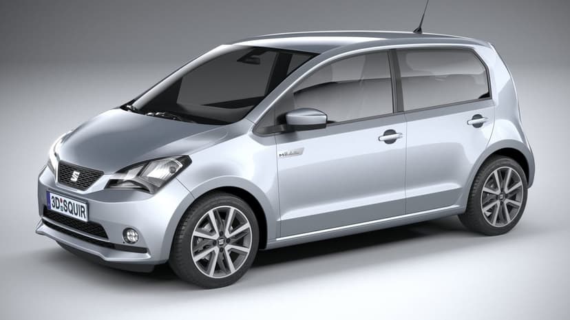 Silver SEAT Mii Electric hatchback in a studio with soft lighting, silver paint, and multi-spoke wheels.