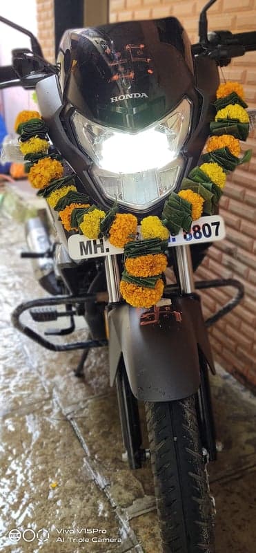 New Honda Motorcycle Decorated with Flower Garlands